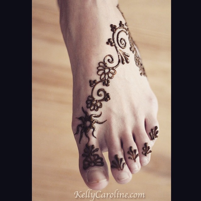 And a cute little foot design for a girl's first time having henna done. She wanted simple flowers and a sun design 