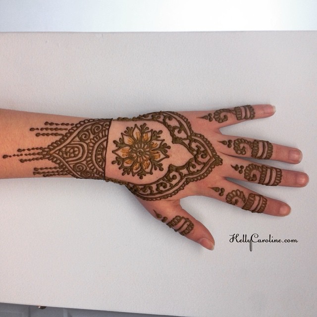 Henna design on the top of the hand with a floral mandala in the center. I loved the little rings on the fingers. #henna #hennas #hennaartist #kellycaroline #michigan #tattoo #tattoos #tattoodesign #design #mehndi #mandala #floral #flower #flowers #artist #art #rings