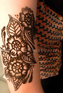 henna on arm with henna, floral henna design