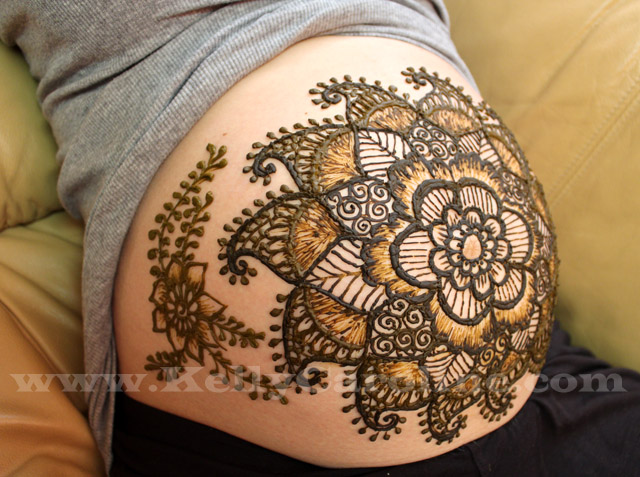 baby belly henna, pregnant belly design, henna flower design