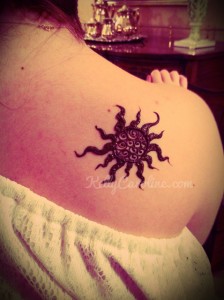 sun henna tattoo on the shoulder