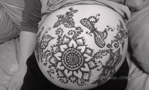 Baby belly henna, henna design, flowers and butterflies henna