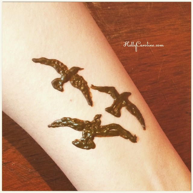 Cute bird henna tattoo design on the wrist