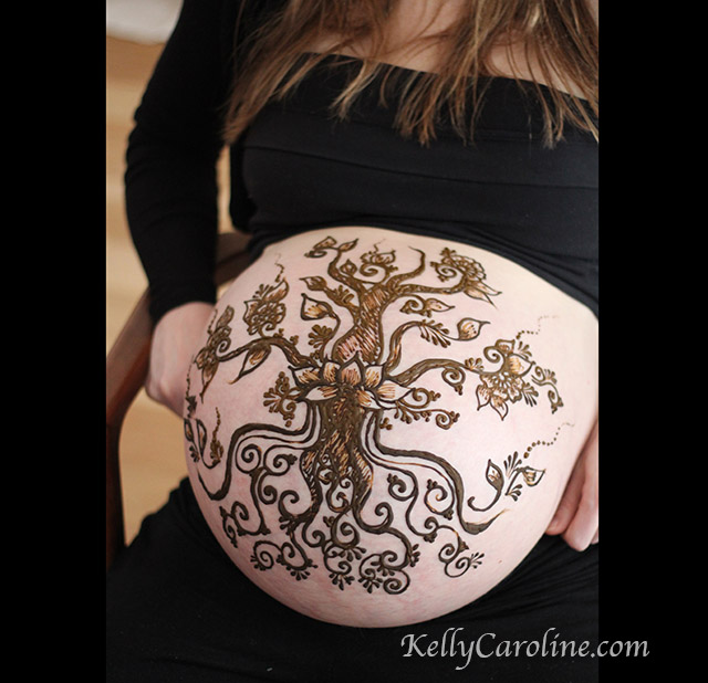 pregnancy henna design with a tree